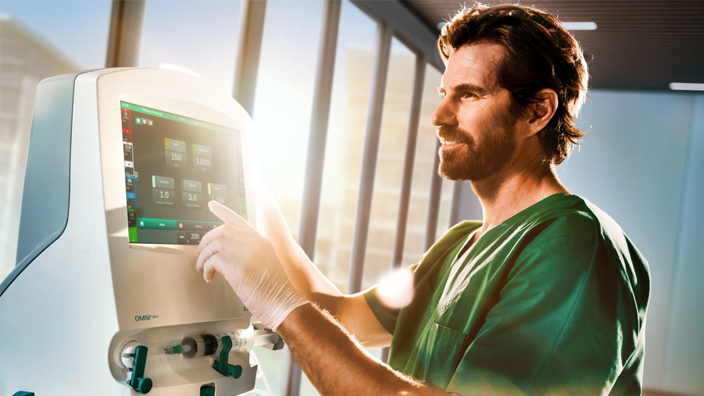 Physician operating the OMNI plus touch screen.