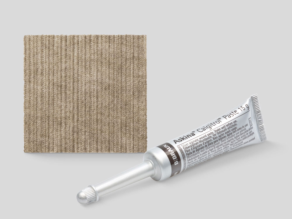 One large and one small Askina Calgitrol paste tube next to each other