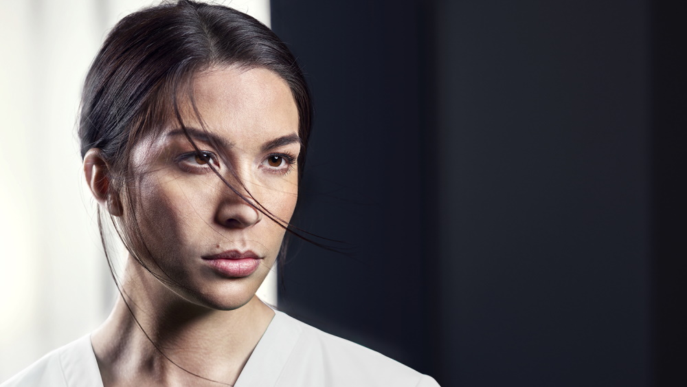 A woman looks intently in one direction